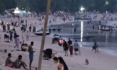 Motorbike taxi speeds along Patong Beach, alarming tourists (video)